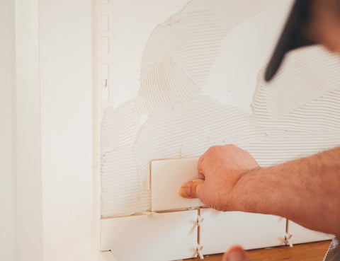 Man installing tile