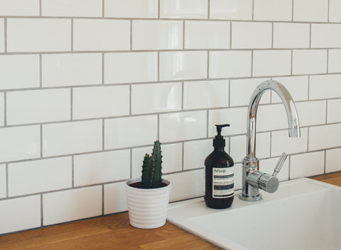 White backsplash with light gray grout