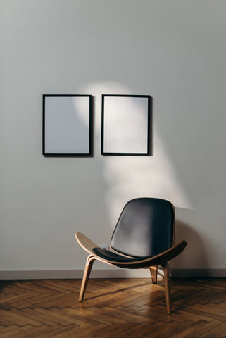 Room with white walls and dark wood flooring