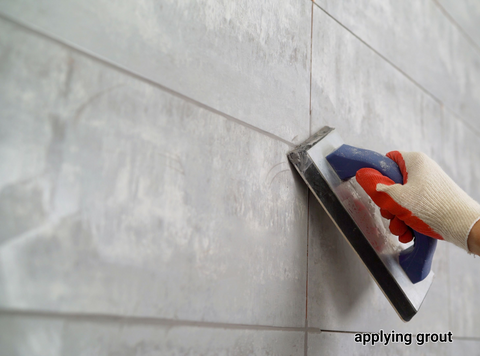 Applying grout with a grout float