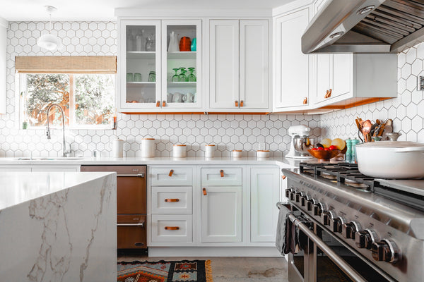 Kitchen with hexagon tile backsplash and marble countertop