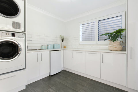 Laundry room with tile floor